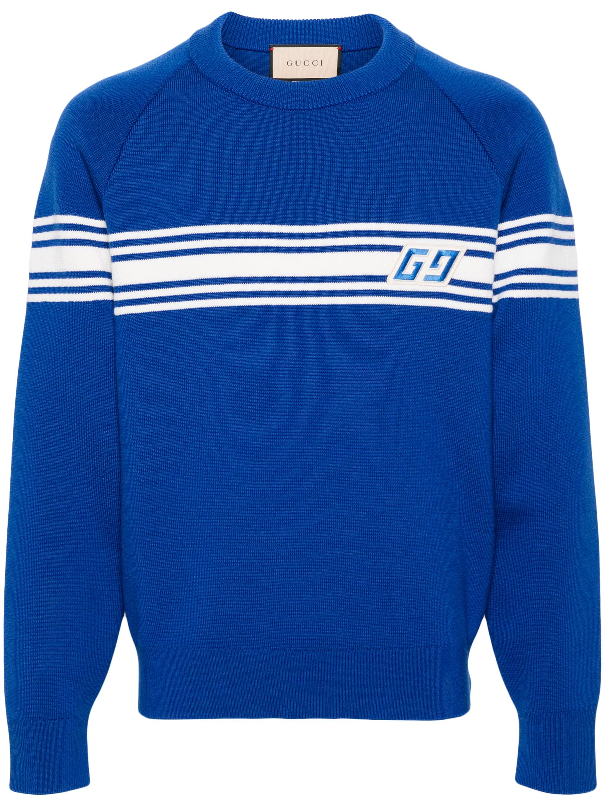 Gucci royal blue knitted sweater with white stripes across the chest and a bold GG angled logo.