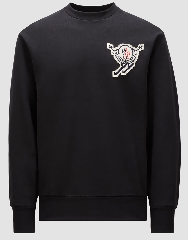 Black Moncler sweatshirt featuring a bold pixelated rooster logo on the chest, blending retro and alpine-inspired design elements.
